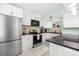 Well-equipped kitchen with stainless steel appliances and granite counters at 5955 Midnight Pass Rd # 4E, Sarasota, FL 34242