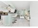 Bright living room with an open floor plan and kitchen bar at 5955 Midnight Pass Rd # 4E, Sarasota, FL 34242