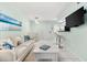 Bright and airy living room with coastal decor and open layout at 5955 Midnight Pass Rd # 4E, Sarasota, FL 34242