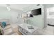 Bright living room features a comfy sofa and a charming coffee table at 5955 Midnight Pass Rd # 4E, Sarasota, FL 34242
