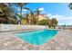 Community pool with plenty of lounge chairs for relaxing at 5955 Midnight Pass Rd # 4E, Sarasota, FL 34242