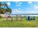 Relaxing waterfront lawn with lounge chairs; great for enjoying the view at 5955 Midnight Pass Rd # 4E, Sarasota, FL 34242