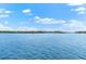 Tranquil waterfront view with homes and lush greenery at 5955 Midnight Pass Rd # 4E, Sarasota, FL 34242