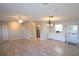 Bright living room with light wood floors and a ceiling fan at 6100 Coral Way, Bradenton, FL 34207