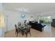 Bright dining area with glass table and chandelier at 6505 Stone River Rd # 105, Bradenton, FL 34203