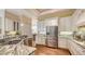 Well-equipped kitchen featuring stainless steel appliances and granite countertops at 8205 Quail Greens Ter, Bradenton, FL 34212