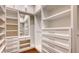 Large walk-in closet with ample shelving and drawers at 8205 Quail Greens Ter, Bradenton, FL 34212