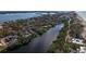 Wide aerial view of waterfront home and neighborhood at 8440 Midnight Pass Rd, Sarasota, FL 34242