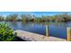 Wooden dock extending into calm waterway at 8440 Midnight Pass Rd, Sarasota, FL 34242