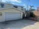 Single car garage with white door and gated backyard access at 8440 Midnight Pass Rd, Sarasota, FL 34242