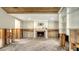 Spacious living area with fireplace undergoing renovations at 8440 Midnight Pass Rd, Sarasota, FL 34242