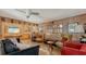 Living room with wood paneling, comfy seating and a retro vibe at 8440 Midnight Pass Rd, Sarasota, FL 34242