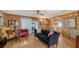 Living room with wood paneling, comfortable seating at 8440 Midnight Pass Rd, Sarasota, FL 34242