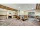 Living room with fireplace and built-in shelving at 8440 Midnight Pass Rd, Sarasota, FL 34242