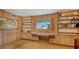 Office with wood paneling, built-in shelves, and desk at 8440 Midnight Pass Rd, Sarasota, FL 34242