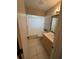 Neat bathroom with tub/shower and light wood vanity at 9359 Casa Grande Ave, Englewood, FL 34224