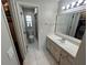 Clean bathroom with a single sink vanity and a shower/tub combo at 9359 Casa Grande Ave, Englewood, FL 34224