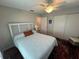Cozy bedroom with a full-size bed and calming decor at 9359 Casa Grande Ave, Englewood, FL 34224