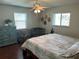 Comfortable bedroom with a large bed, dresser, and plenty of natural light at 9359 Casa Grande Ave, Englewood, FL 34224
