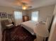 Well-lit bedroom with a full-size bed and hardwood floors at 9359 Casa Grande Ave, Englewood, FL 34224