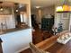 Spacious dining area with a large wooden table and kitchen views at 9359 Casa Grande Ave, Englewood, FL 34224
