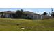 Ranch-style house with attached garage and fenced backyard at 9359 Casa Grande Ave, Englewood, FL 34224