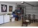 Bright garage laundry with storage and seating area at 9359 Casa Grande Ave, Englewood, FL 34224