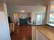 Open concept kitchen with breakfast bar and hardwood floors at 9359 Casa Grande Ave, Englewood, FL 34224
