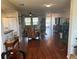 Bright and airy living room with hardwood floors and comfy seating at 9359 Casa Grande Ave, Englewood, FL 34224