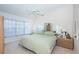 Spacious bedroom with a king-size bed and bay window at 1005 Ibis Ct, Bradenton, FL 34209