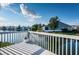 White deck overlooking a lake with houses in the background at 1005 Ibis Ct, Bradenton, FL 34209