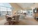 Bright dining area with table and chairs, open to living room at 1005 Ibis Ct, Bradenton, FL 34209