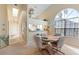 Bright dining room with a round table and access to the kitchen at 1005 Ibis Ct, Bradenton, FL 34209