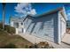 Side view of home showcasing garage and landscaping at 1005 Ibis Ct, Bradenton, FL 34209