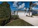 Front exterior of home with two-car garage and landscaping at 1005 Ibis Ct, Bradenton, FL 34209