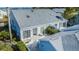 Back exterior showcasing patio, landscaping and water view at 1005 Ibis Ct, Bradenton, FL 34209