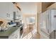 White kitchen with light green countertops and breakfast nook at 1005 Ibis Ct, Bradenton, FL 34209