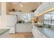 White kitchen with light green countertops and modern appliances at 1005 Ibis Ct, Bradenton, FL 34209