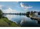 Tranquil lake view with houses and lush greenery at 1005 Ibis Ct, Bradenton, FL 34209