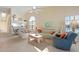 Open living room with high ceilings and views of kitchen and water at 1005 Ibis Ct, Bradenton, FL 34209