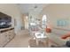 Open concept living room with kitchen and dining areas visible at 1005 Ibis Ct, Bradenton, FL 34209