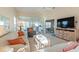 Living room with view of lanai and access to Primary bedroom at 1005 Ibis Ct, Bradenton, FL 34209
