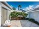 Private patio with lush landscaping and seating area at 1005 Ibis Ct, Bradenton, FL 34209