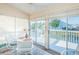 Sunroom with water views and access to private deck at 1005 Ibis Ct, Bradenton, FL 34209