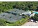 Community tennis courts and pool viewed from above at 10656 Glencorse Ter, Bradenton, FL 34211