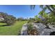 Landscaped backyard with gravel pathways and tropical plants at 10656 Glencorse Ter, Bradenton, FL 34211