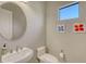 Small, clean powder room with pedestal sink and toilet at 10656 Glencorse Ter, Bradenton, FL 34211