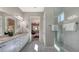 Spa-like bathroom with double sinks and a view of the bedroom at 10656 Glencorse Ter, Bradenton, FL 34211