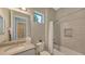 Modern bathroom with a shower/tub combo, vanity, and tile flooring at 10656 Glencorse Ter, Bradenton, FL 34211