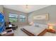 Spacious bedroom with platform bed and large windows at 10656 Glencorse Ter, Bradenton, FL 34211